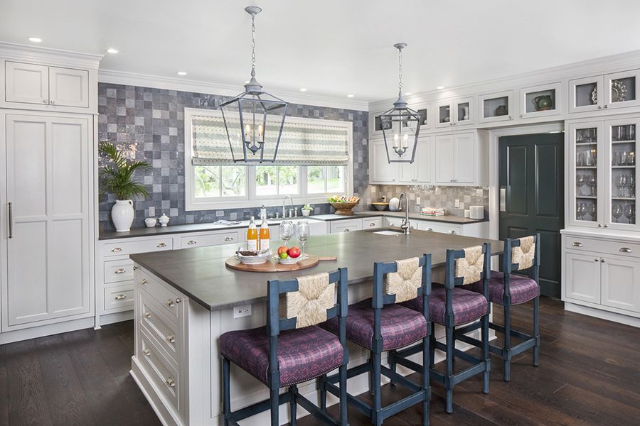 White Kitchen with Blue Tile Backsplash and Glass Cabinetry