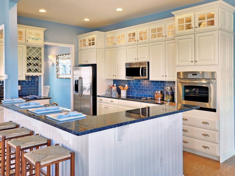 White Kitchen with Blue Backsplash